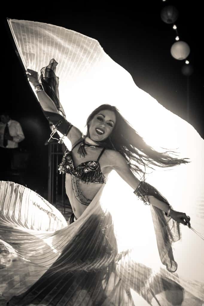 Belly Dancer Carrara Nour of Orlando performs with Isis wings at a Puerto Rican and Armenian wedding at Estate of Johns Lake in Oakland, Florida. Photo: Scott Trippler Studios