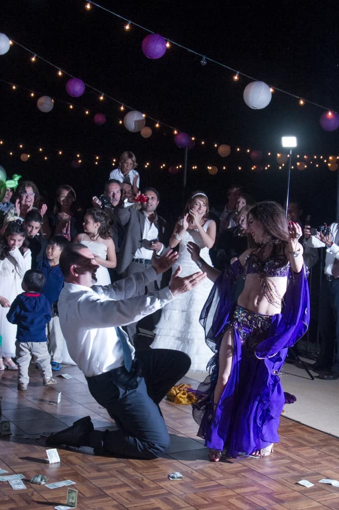 Belly Dancer Carrara Nour performs at an Armenian and Puerto Rican wedding at Estate of Johns Lake in Oakland, Florida. Photo: Scott Trippler Studios