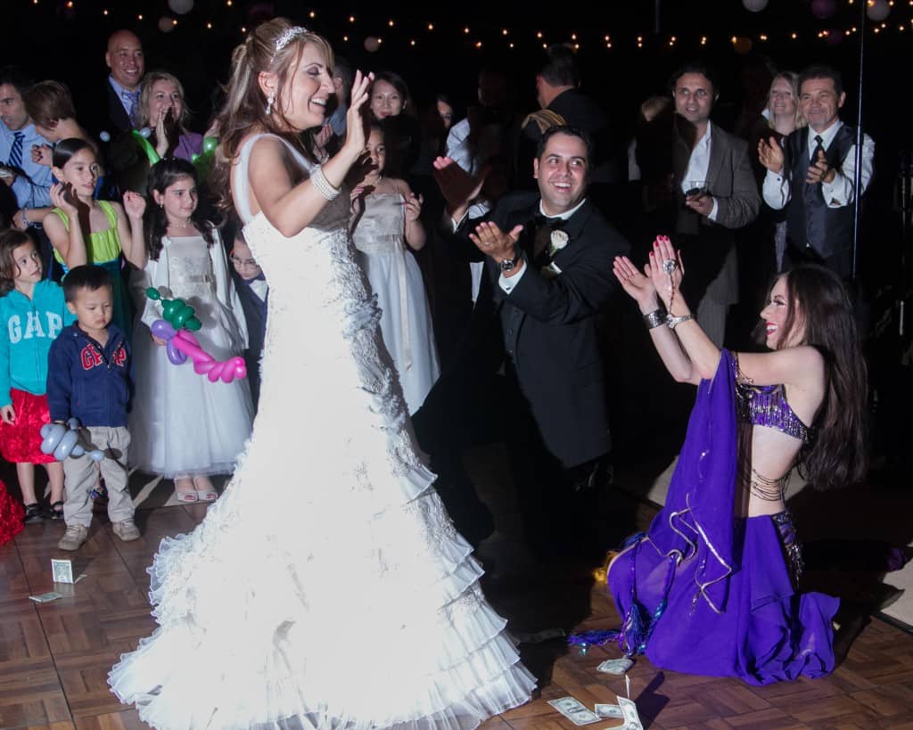 Belly Dancer Carrara Nour performs at an Armenian and Puerto Rican wedding at Estate of Johns Lake in Oakland, Florida. Photo: Scott Trippler Studios