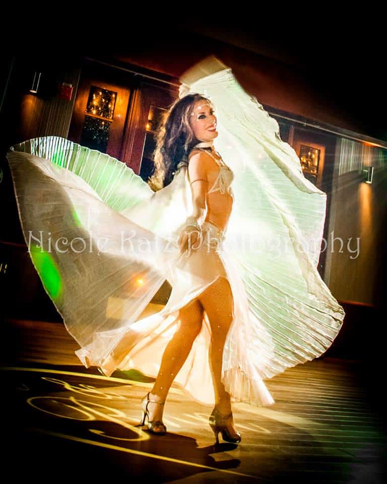 Carrara Nour, wedding belly dancer in Orlando, dances with isis Wings at a Lake Mary wedding reception
