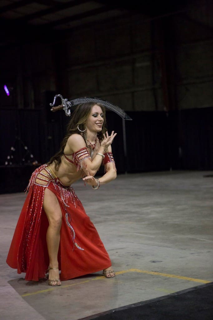 Belly dancer Carrara Nour performs with a sword at an Orlando corporate event