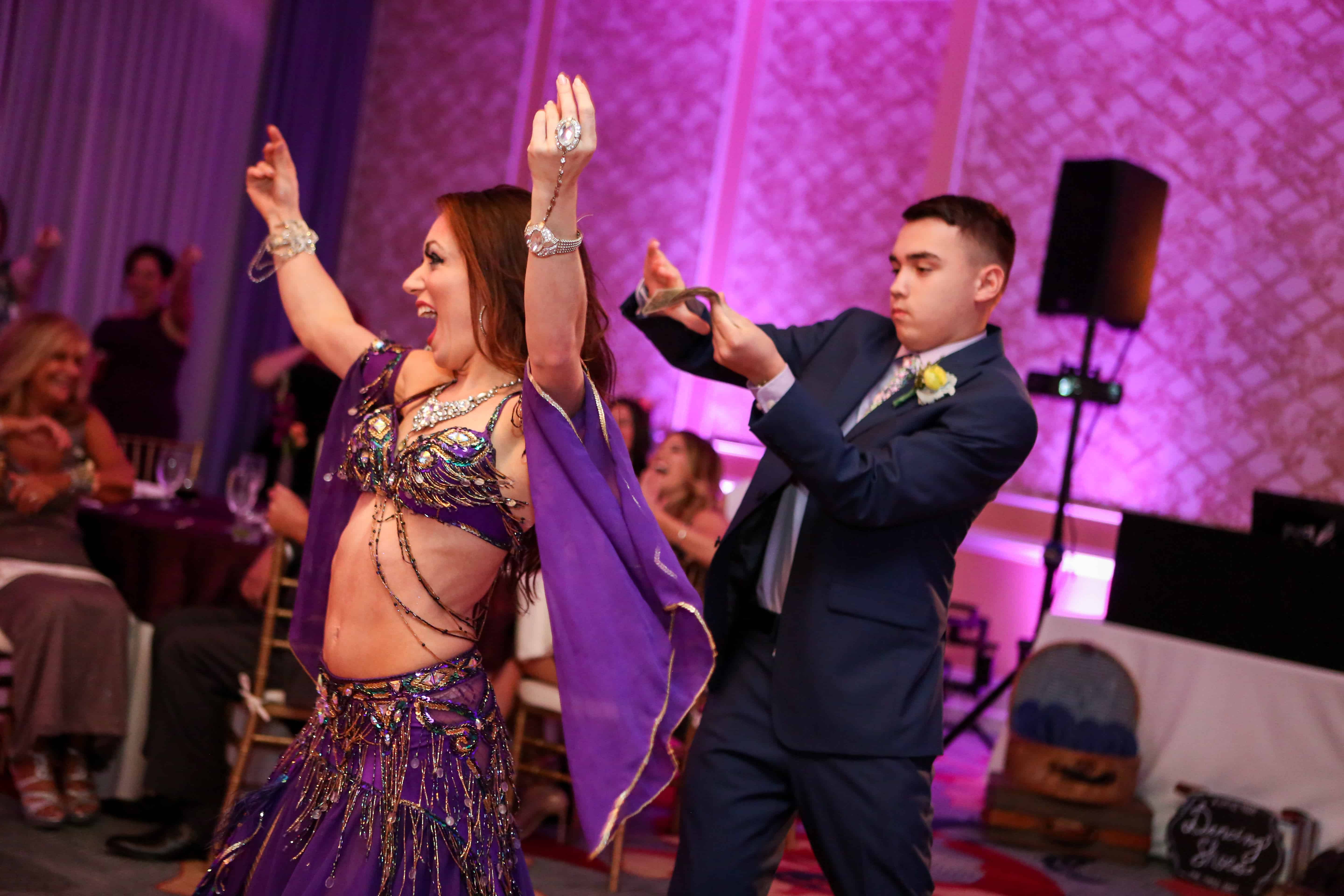 Carrara performs belly dance at an LGBT wedding at Omni Championsgate. Photo by LiveHappy Studio