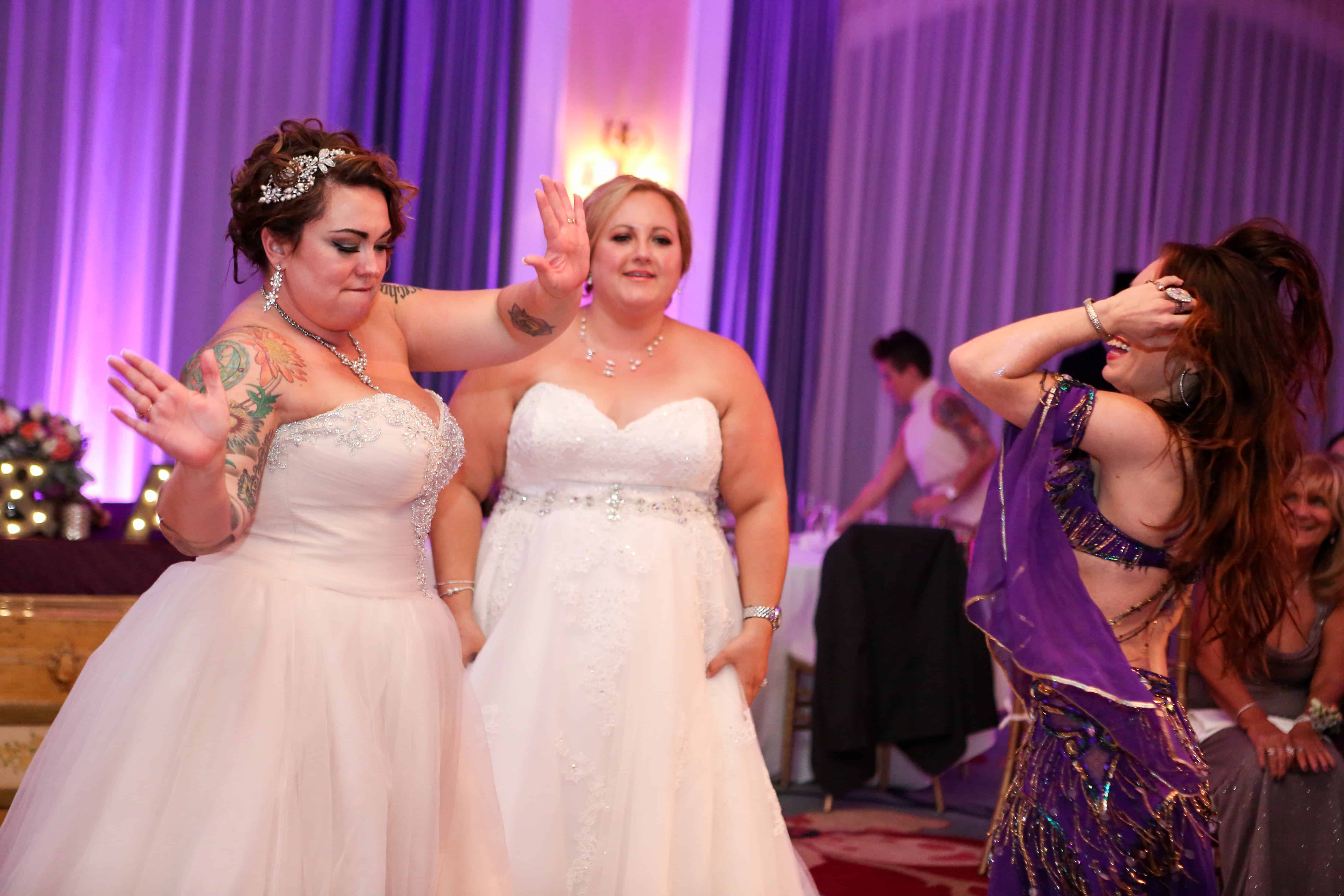 Carrara performs belly dance at an LGBT wedding at Omni Championsgate. Photo by LiveHappy Studio