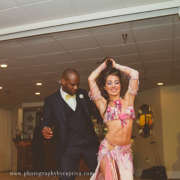 Carrara Nour performs belly dance at a Haitian wedding at Crystal Ballroom on the Lake, Altamonte Springs, FL. Photo: Photography by Captiva